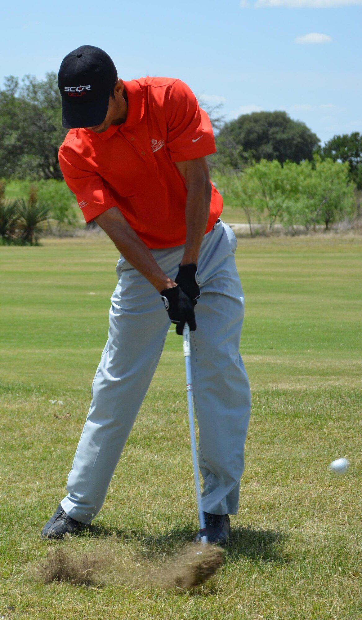 Arnie Martinez strikes the ball during the second annual MXG Golf Tournament held May 2 at the Alsatian Golf Club in Castroville, Texas. The tournament raised $1,700 for the Morale and Welfare Fund. (U.S. Air Force Photo/ Maj. Tim Wade)