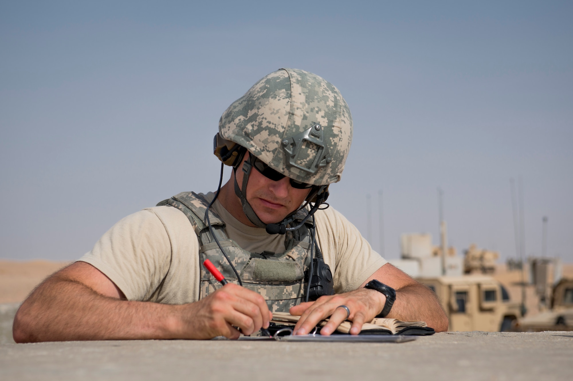 U.S. Air Force Senior Airman Michael Bradley, 82nd Expeditionary Air Support Operations Squadron, prepares for a Joint Operations live fire exercise on May 7, 2014 at an undisclosed location in Southwest Asia. Bradley is a Tactical Air Control Party member deployed from the 13th Air Support Operations Squadron, Fort Carson, Colo. The operation consisted of Army, Air Force, and Navy personnel working together to conduct a coordinated strike against a single target. (U.S. Air Force photo by Staff Sgt. Jeremy Bowcock)