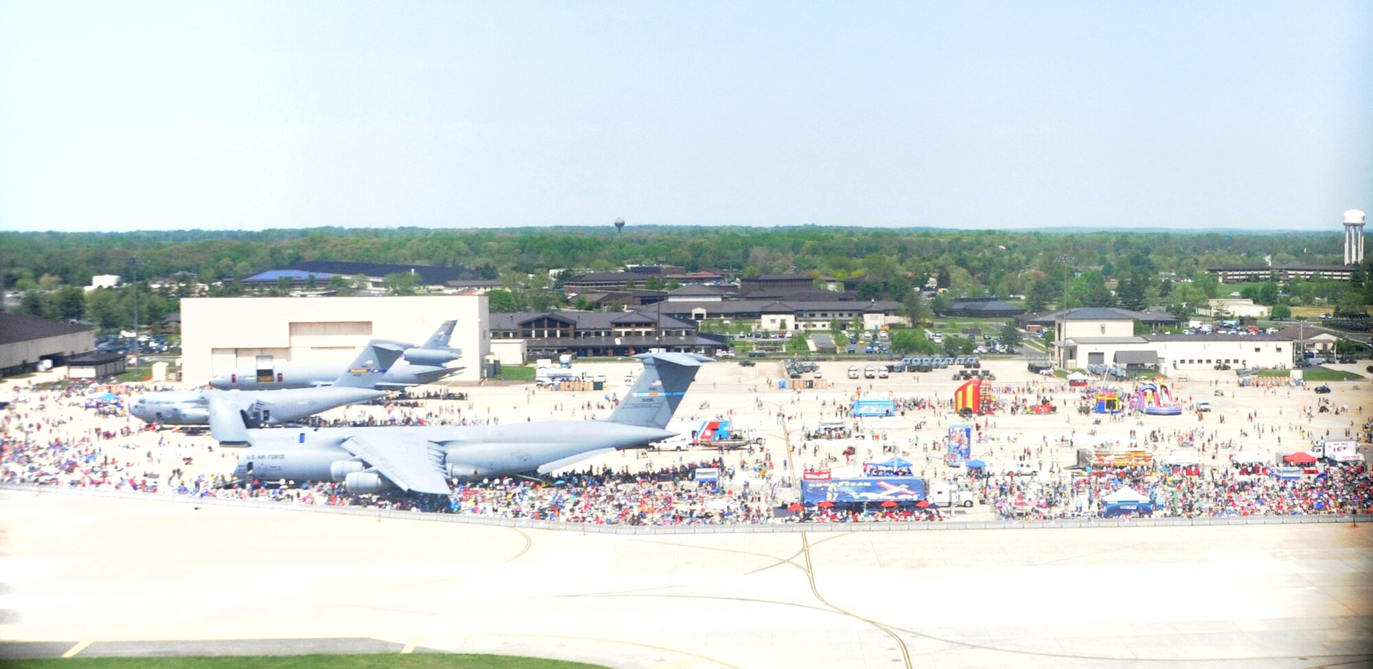 Community members from the tri-state area watch performers at the Open House and Air Show May 11, 2014, at Joint Base McGuire-Dix-Lakehurst, N.J. The Open House and Air Show provided more than 300,000 visitors an opportunity to learn more about America's only tri-service joint base, which included demonstrations and static displays of aircraft and vehicles from all five services and various civilian agencies throughout the two-day event.  (U.S. Air Force photo by Airman 1st Class Sean M. Crowe/Released)
