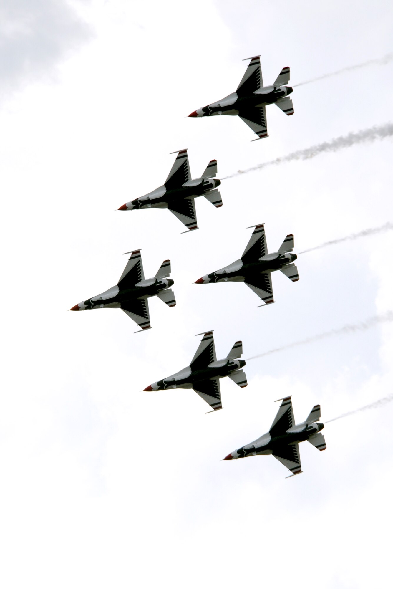 The Air Force Thunderbirds aerial demonstration team flies in formation for the Open House and Air Show audience May 10, 2014, at Joint Base McGuire-Dix-Lakehurst, N.J. The Open House and Air Show provided more than 300,000 visitors an opportunity to learn more about America's only tri-service joint base, which included demonstrations and static displays of aircraft and vehicles from all five services and various civilian agencies throughout the two-day event.  (U.S. Air Force photo by Airman 1st Class Sean M. Crowe/Released)
