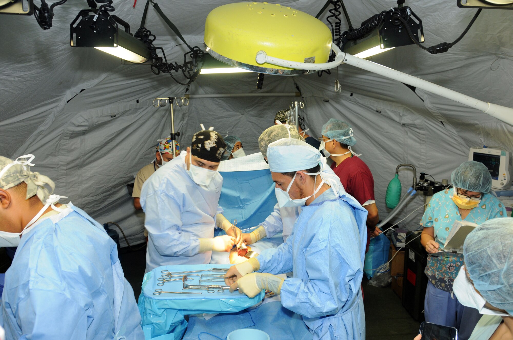 Joint Task Force-Bravo's Mobile Surgical Team and the surgical staff of the Santa Rosa hospital in the city of Santa Rosa de Copan, Department of Copan, Honduras perform gall bladder removal surgery on a Honduran man during a Medical Readiness Training Exercise May 5-9.  These surgeries, which are often very expensive for Honduran nationals, were provided free of charge.  The work of the MST helped support Honduran medical capabilities while continuing to strengthen the relationship between JTF-Bravo and its partner nation.  (Photo by U. S. Air National Guard Capt. Steven Stubbs)
