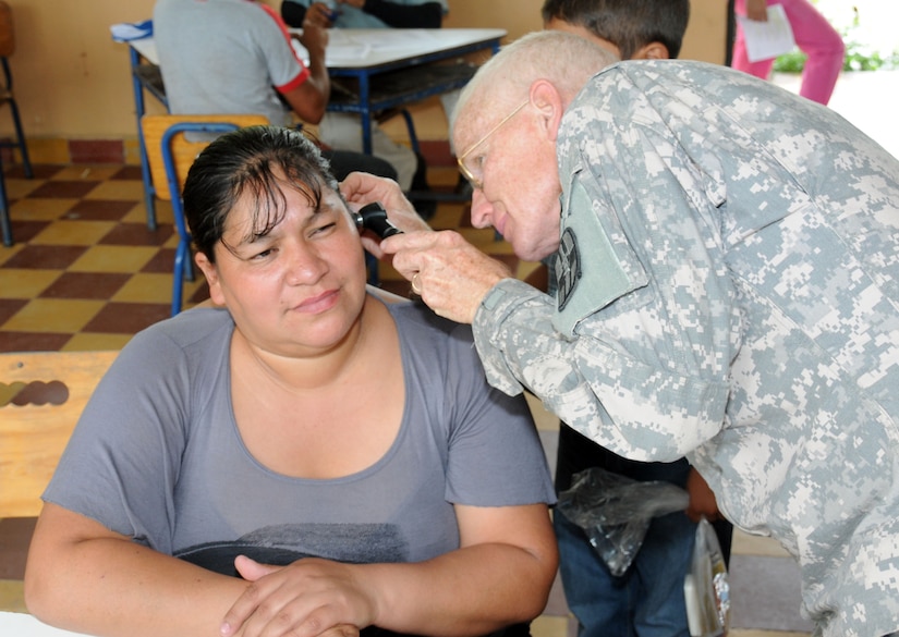 U. S. Army Lt. Col. Robert Walkup performs a medical examination on a Honduran woman during a Medical Readiness Training Exercise (MEDRETE) May 5-9.  The MEDRETE was conducted by Joint Task Force-Bravo's Medical Element, with support from the JTF-Bravo Joint Security Forces and Army Forces Battalion, in partnership with the Honduran Ministry of Health and the Honduran military to provide medical care to more than 720 people in the remote village of La Arena in the Copan region of Honduras.  The team worked together to provide preventative medicine to the villagers, including classes on hygiene, preventative dental care and nutrition.  They also provided immunizations to children, dental care, wellness checkups, medications and minor medical procedures.  (Photo by U. S. Air National Guard Capt. Steven Stubbs)
