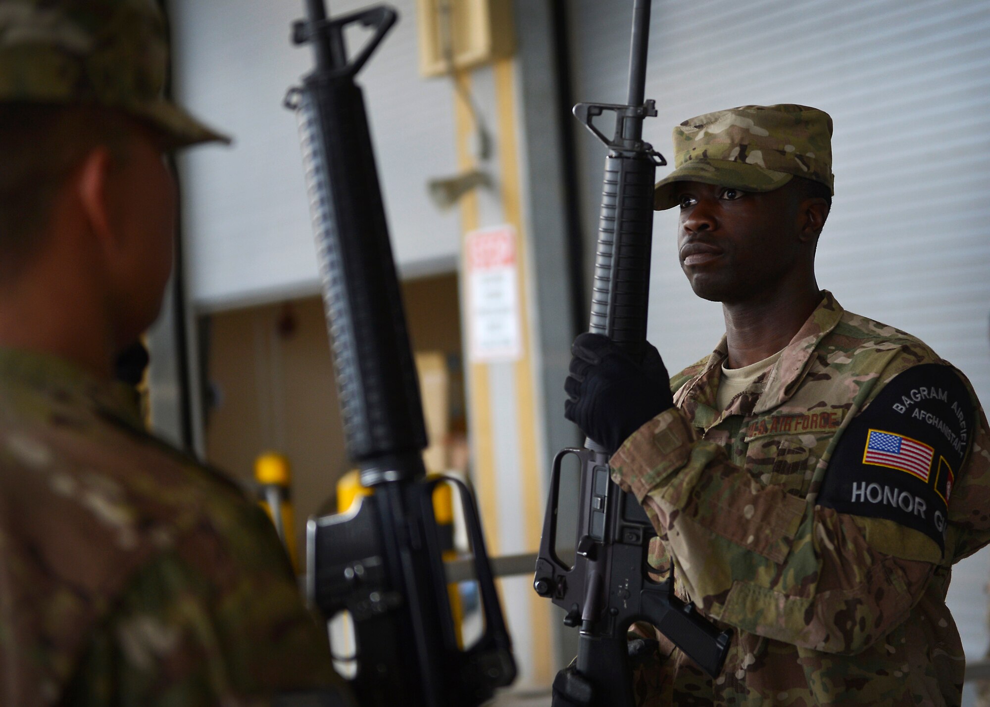 Senior Airman Adrian Whitehurst, 455th Expeditionary Logistics Readiness Squadron, rehearses his drill movements for a Change of Command ceremony May 9, 2014 at Bagram Airfield, Afghanistan.  Whitehurst is part of Bagram’s honor guard.   As an honor guardsman, he must demonstrate dedication, commitment and precision, as well as skillfull excecution of ceremonial drills. Whitehurst is deployed from Travis Air Force Base, Calif and a native of Chesapeake, Va. (U.S. Air Force by Staff Sgt. Evelyn Chavez/Released)