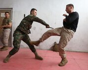 Staff Sgt. William Mullen dodges a strike from Pvt. Hassain Haj Hassan of the 4th Intervention Regiment as part of a Marine Corps Martial Arts Program demonstration given during an enlisted leadership seminar hosted by the 4th Intervention Regiment in Beirut, Lebanon on March 13, 2014. During the seminar, Marines from Command Element Marine Forces Central Command Forward and soldiers from the 4th Intervention Regiment discussed leadership principles and the role of Non-Commissioned Officers in military units.  (U.S. Marine Corps photo by; Sgt James A. Hall, CE MARFOR CENTCOM (FWD) Combat Camera/Released)