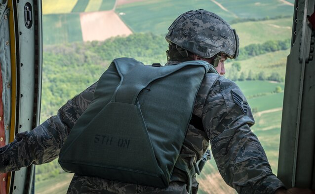 Air Force Staff Sgt. Jonathan Smith, 435th Security Forces Squadron jumpmaster, scans a landing zone in preparation for aerial disembarkments inside a C-130J Super Hercules as part of International Jump Week over Germany May 5, 2014. A total of 97 foreign and allied partners tested, built and strengthened partnerships during jump week alongside American Airmen and Soldiers. (U.S. Air Force photo/Airman 1st Class Jordan Castelan)