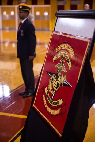 A member of the Montford Point Marine Association stands in the background of the new battalion logo for 2nd Supply Battalion, 2nd Marine Logistics Group during a ceremony at Camp Lejeune, N.C., May 6, 2014. Approximately 20,000 African-American recruits enlisted into the Marine Corps and reported for training at Montford Point, N.C., during World War II and performed vital logistics missions in support of the Pacific Campaign.


