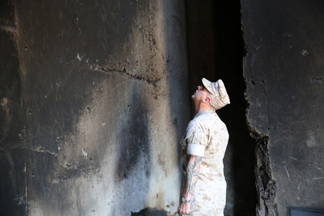 Gunnery Sergeant Dustin Hamilton, special government employee (safety inspector) on Marine Corps Logistics Base Barstow, Calif., inspects the base fire department’s training complex, April 10. The complex gets inspected semiannually to ensure the safety of the firemen while they conduct training scenarios.
