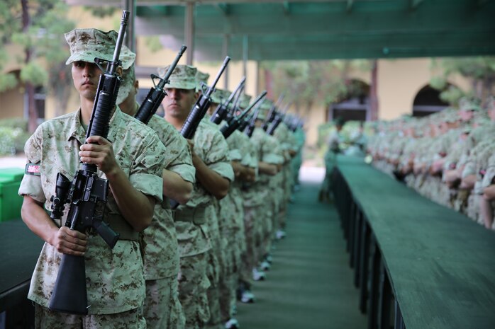 Recruits of Company B, 1st Recruit Training Battalion, Marine Corps Recruit Depot San Diego, stand in line after they receiving a M16-A4 service rifle during their rifle issue aboard the depot, April 21. The reality of what they held in their hands, what the weapon was capable of, dawned on recruits and made them realize the responsibility being put on them.
