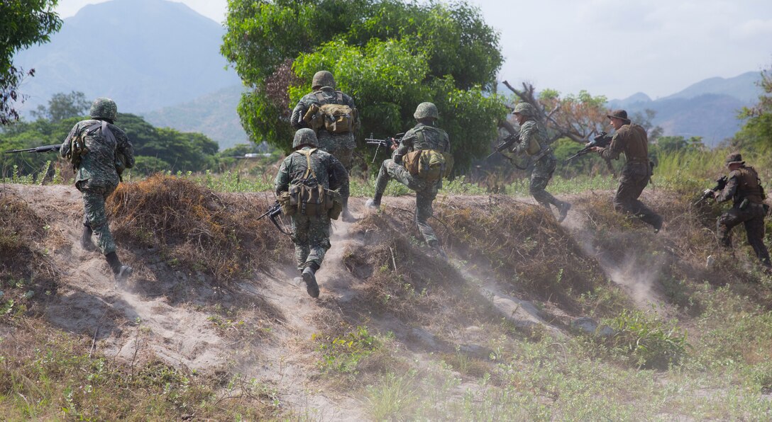 Courtesy Photo


Philippine and U.S. Marines conduct a bilateral amphibious assault near Zambales, Philippines, May 9, 2014, as part of Balikatan 2014. The assault enhanced Marine landing maneuvers and expeditionary capabilities, optimizing combined operations for the future. Balikatan is an annual training exercise that strengthens the interoperability between Armed Forces of the Philippines and U.S. military in their commitment to regional securing and stability, humanitarian assistance and disaster relief. 