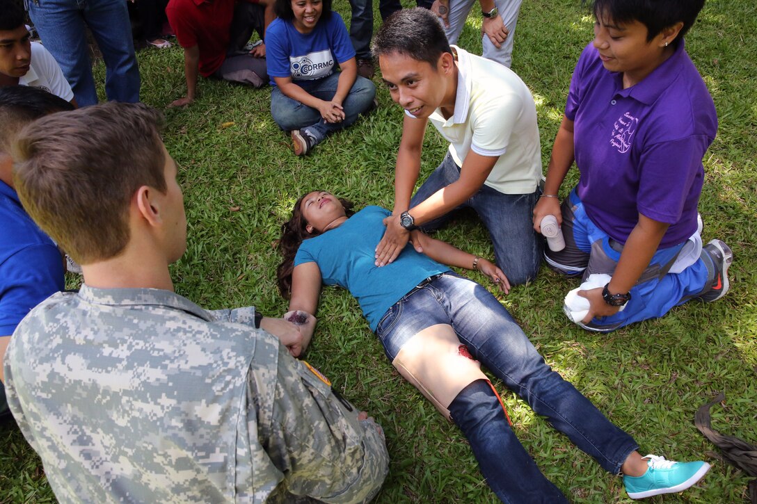 Students practice performing cardiopulmonary resuscitation as part of the practical application exam May 2 during first responder training in Legazpi City, Albay province, Philippines. The medical training is part of Exercise Balikatan, an annual bilateral training exercise that increases interoperability and enhances military-to-military relations between the Philippines and the U.S.
