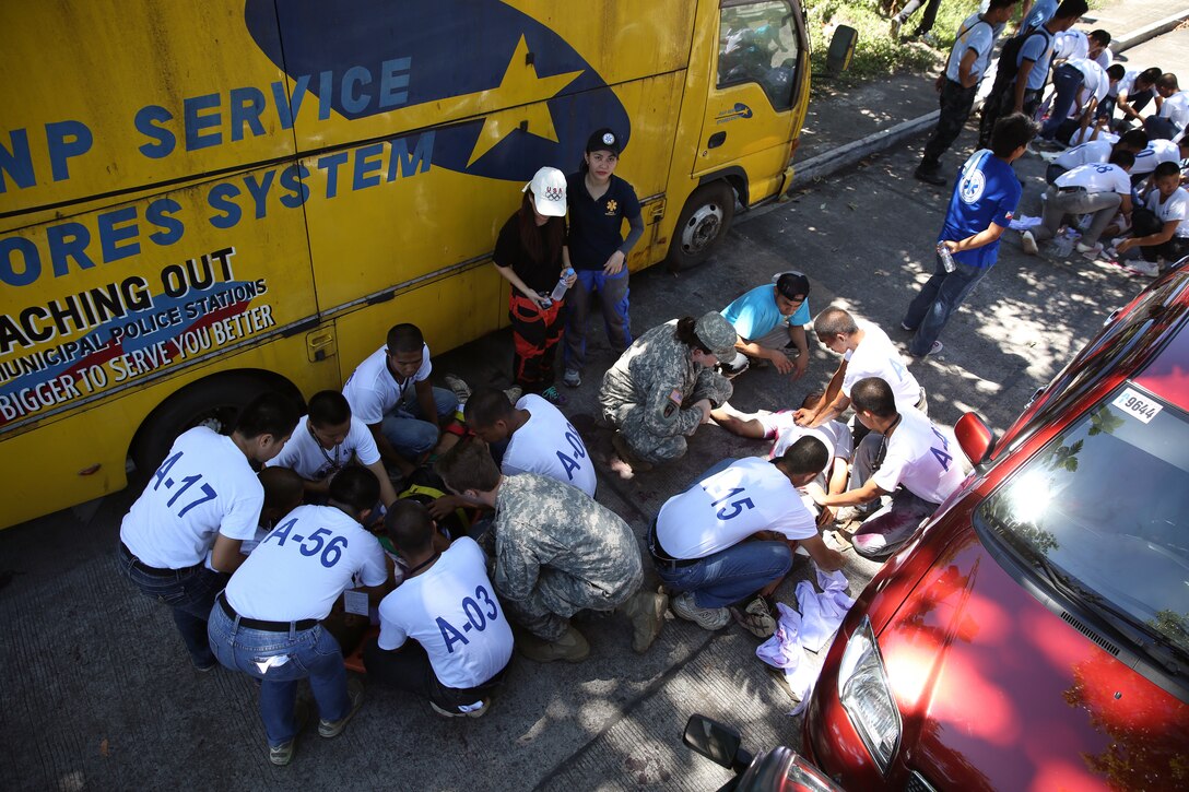 Members of the Philippine National Police and U.S. armed forces work together to finish their first responder practical application exam May 8 during a first responder training course in Legazpi, City, Albay province, Philippines. The seminar was part of Exercise Balikatan, a annual bilateral training exercise that strengthens interoperability and enhances military-to-military relations between the U.S. and the Philippines.