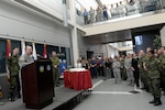 Army Gen. Charles ‘Chuck’ Jacoby, North American Aerospace Defense Command and U.S. Northern Command commander, speaks to a crowd of command members in the atrium of the headquarters building on Peterson Air Force Base, Colo. The crowd gathered to celebrate NORAD’s 56 birthday.  Photo by Air Force Master Sgt. Andy Bellamy/Released.