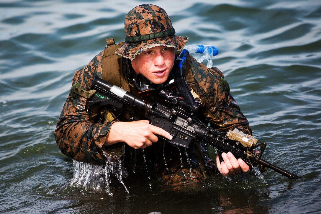 A U.S. Marine with 3rd Reconnaissance Battalion approached the shoreline for a “hasty beach report” during an amphibious landing exercise between the Philippine and the U.S. Marine Corps at the Naval Education Training Center here May 9. The training evolution, as part of Balikatan 2014, aimed at enhancing interoperability and strengthening the Philippine-U.S. relationship.