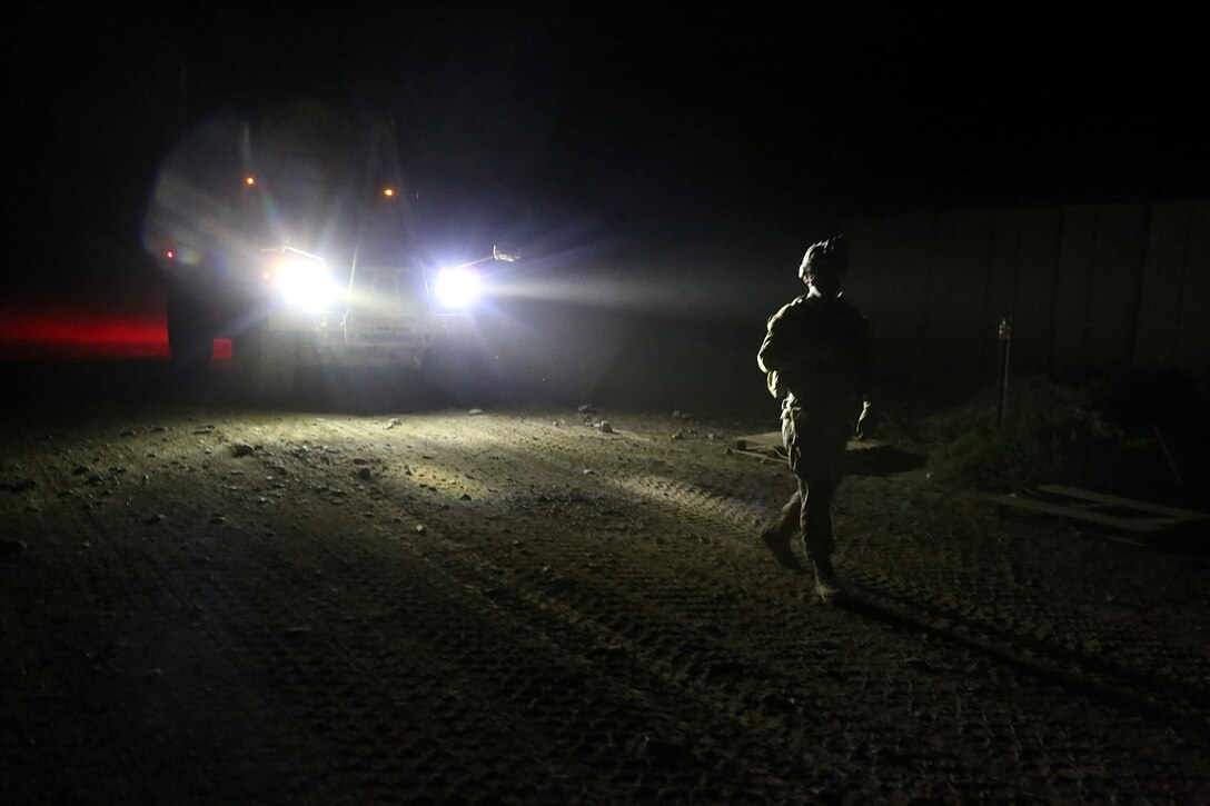 Gunnery Sgt. Michael Hutton, company gunnery sergeant, “Suicide” Charley Company, 1st Battalion, 7th Marine Regiment, and a native of McLennan County, Texas, ground guides the final vehicle out of Forward Operating Base Sabit Qadam, Afghanistan, May 5, 2014. The company turned over full security responsibilities of the FOB to the ANA, May 5. The infantrymen of 1st Bn., 7th Marines, were the final Marines to occupy FOB Sabit Qadam and the surrounding area in Sangin District.