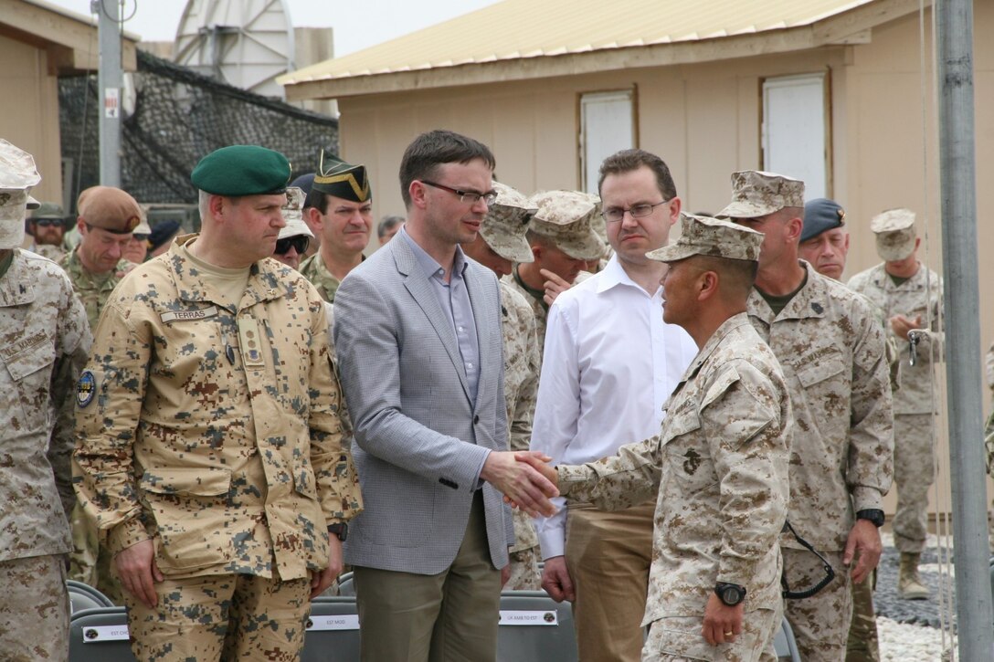 Brigadier Gen. Daniel D. Yoo, right, Commander of Regional Command (Southwest), shakes hands with Estonia’s Minister of Defence, Sven Mikser, after a flag-lowering ceremony for the Estonian Contingent aboard Camp Leatherneck, Helmand province, Afghanistan, May 9, 2014. This was the 17th and last Estonian Contingent to deploy to Afghanistan.