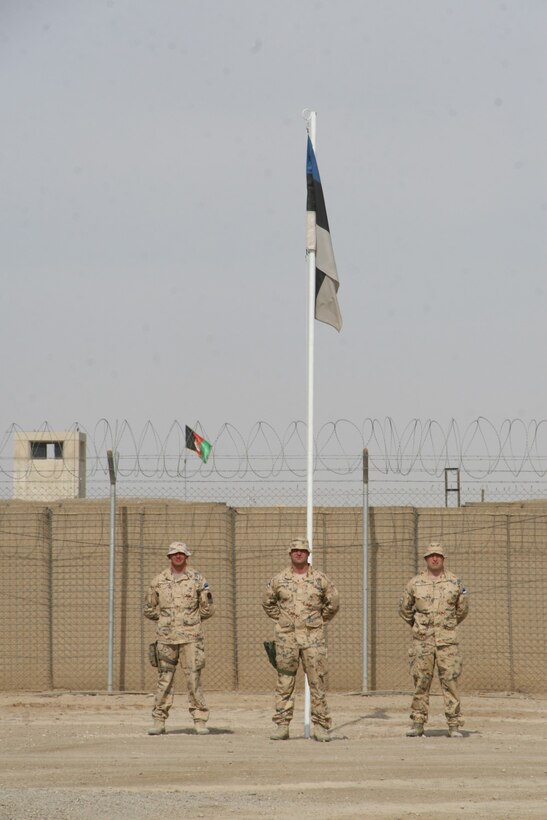Soldiers with the Estonian Contingent stand before their flag during a farewell ceremony held aboard Camp Bastion, Helmand province, Afghanistan, May 9, 2014. This was the 17th and last Estonian Contingent to deploy to Afghanistan.