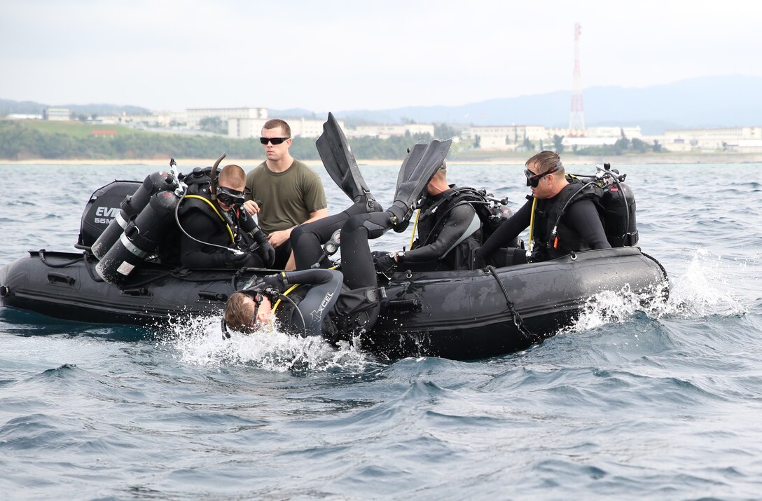 Staff Sgt. Timothy D. Cunningham enters the water May 7 off the shore of Camp Schwab. Marines and sailors executed sustainment training to enhance their scuba diving skills and tactics. “This training is important because diving is inherently dangerous, so we need to do this in order to maintain proficiency,” said Cunningham, an Albany, N.Y., native. “We need to not only concentrate on our closed circuit training, but our open circuit scuba diving proficiency as well.” Cunningham is an assistant team leader and reconnaissance man with 3rd Reconnaissance Battalion, 3rd Marine Division, III Marine Expeditionary Force. 