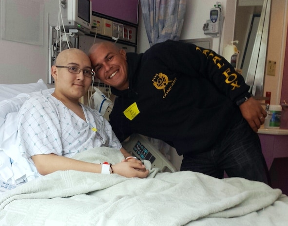 Staff Sgt. Juan Garcia, platoon sergeant, 2nd Platoon, General Support Motor Transport Company, Combat Logistics Regiment 1, 1st Marine Logistics Group, visits with his 16-year old cousin, Diego Romero, at University of California San Francisco Children’s Hospital on April 19, 2014. Nineteen Marines with 2nd Plt. shaved their heads as an act of support to show Romero, that there is nothing wrong with being bald. Romero recently started receiving treatments for leukemia. After Romero’s parents divorced, Garcia took on an important role in raising him, and they developed a father-son relationship.