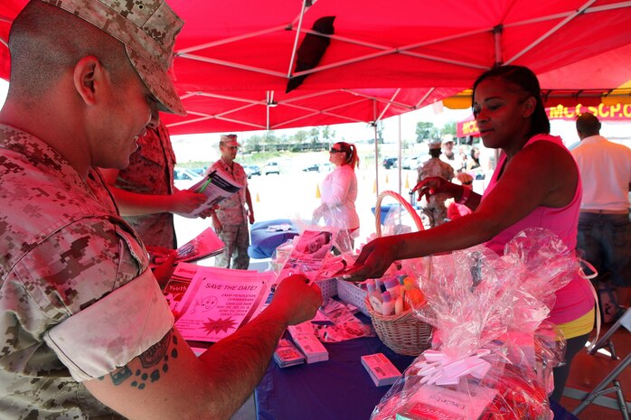 Marines with Combat Logistics Regiment 1, 1st Marine Logistics Group, learn about newborn care during Operation Parenthood aboard Camp Pendleton, Calif., May 1, 2014. Operation Parenthood is a one day event designed to help promote the health, well-being and safety of military families who are expecting a baby or have young children. This year, families from throughout 1st MLG participated in an event which focused on educating parents on topics like parental guidance, mood and anxiety disorders, available summer camps, daycares, life guard training, single father resources, health care, schooling and family counseling. 