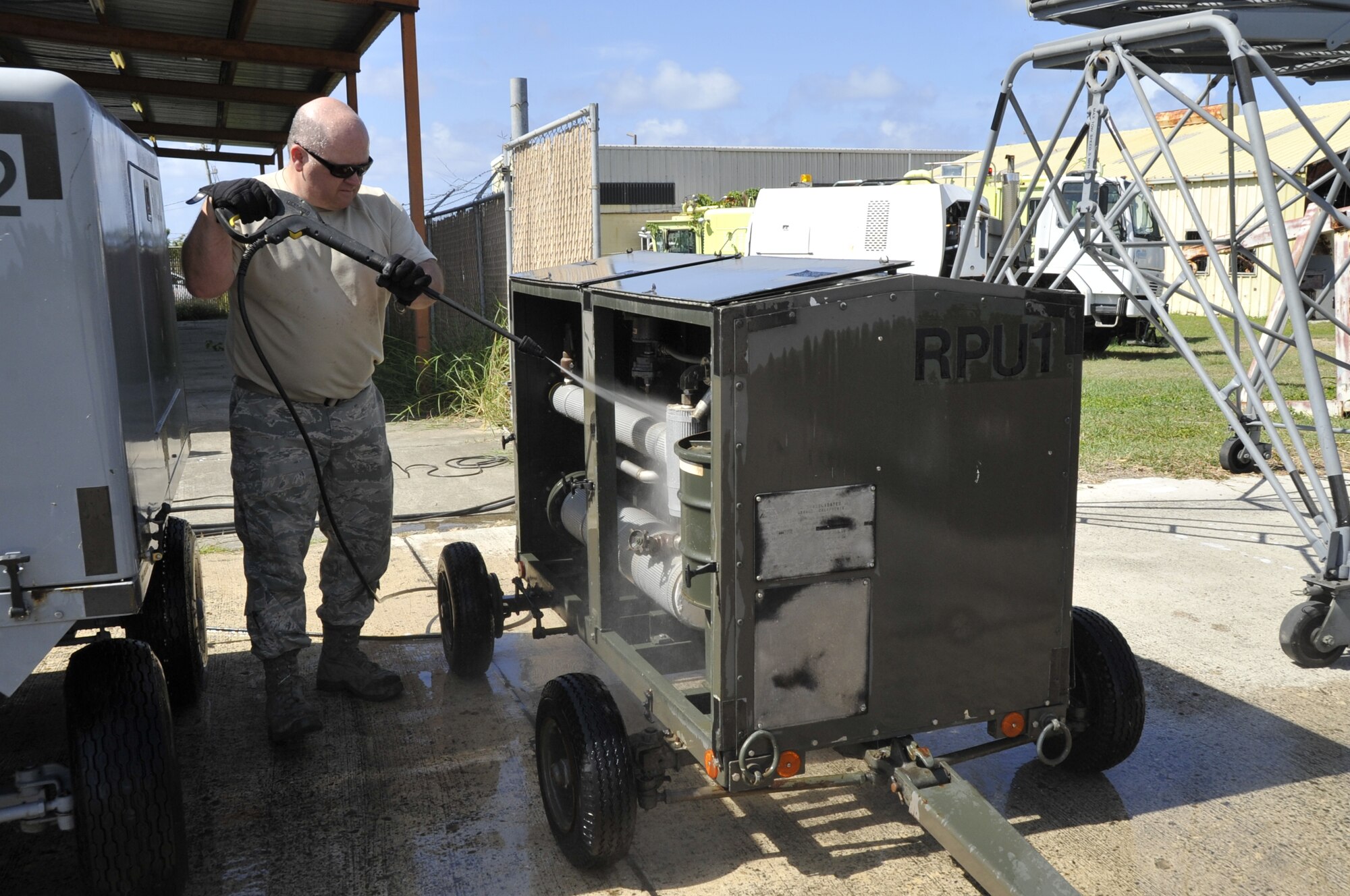 Tech. Sgt. Todd Clemons, 403rd Maintenance Squadron aerospace ground equipment craftsman, cleans a purge cart at the Henry E. Rohlsen Airport in St. Croix, U.S. Virgin Islands May 5-11, 2014. This piece of equipment, used to purge liquid oxygen that remained on the island for the winter season had to be cleaned for use during the upcoming hurricane season. (U.S. Air Force photo/Master Sgt. Jessica L. Kendziorek)