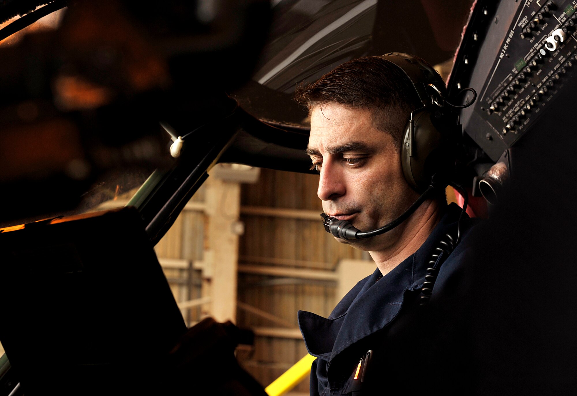 U.S. Air Force Tech. Sgt. Thomas Burger, 33rd Helicopter Maintenance Unit guidance and control specialist, checks technical orders during a quality assurance inspection on Kadena Air Base, Japan, May 9, 2014. The quality assurance has a set amount of inspections in many different areas. The quality assurance inspection must be conducted after every 600 flight hours of the aircraft. (U.S. Air Force photo by Naoto Anazawa)