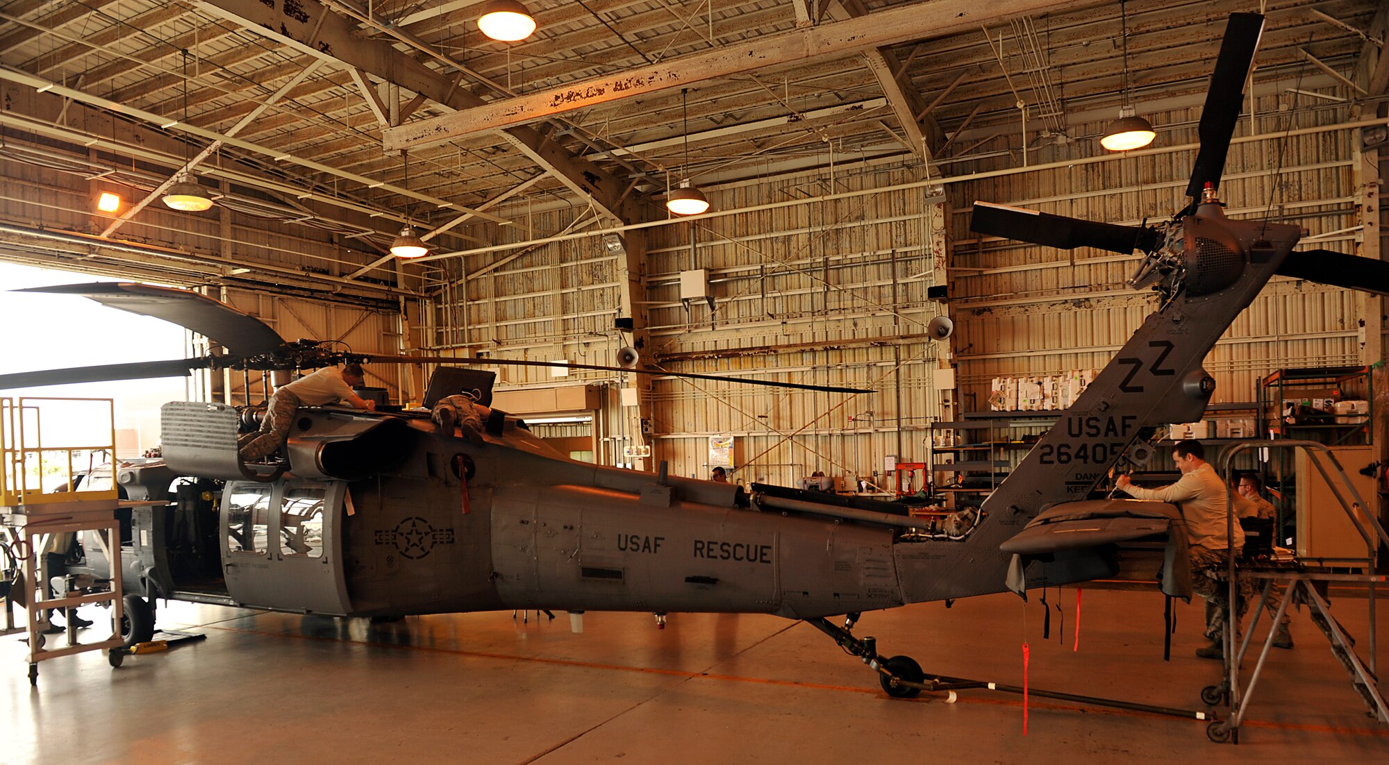 Members of the 33rd Helicopter Maintenance Unit inspect an HH-60G Pave Hawk helicopter during a quality assurance inspection on Kadena Air Base, Japan, May 9, 2014. The 33rd HMU quality assurance inspectors have to inspect the aircraft using technical data, their maintenance standardization, and evaluation program guidebooks to look for anything that was not fixed according to the technical data. (U.S. Air Force photo by Naoto Anazawa)