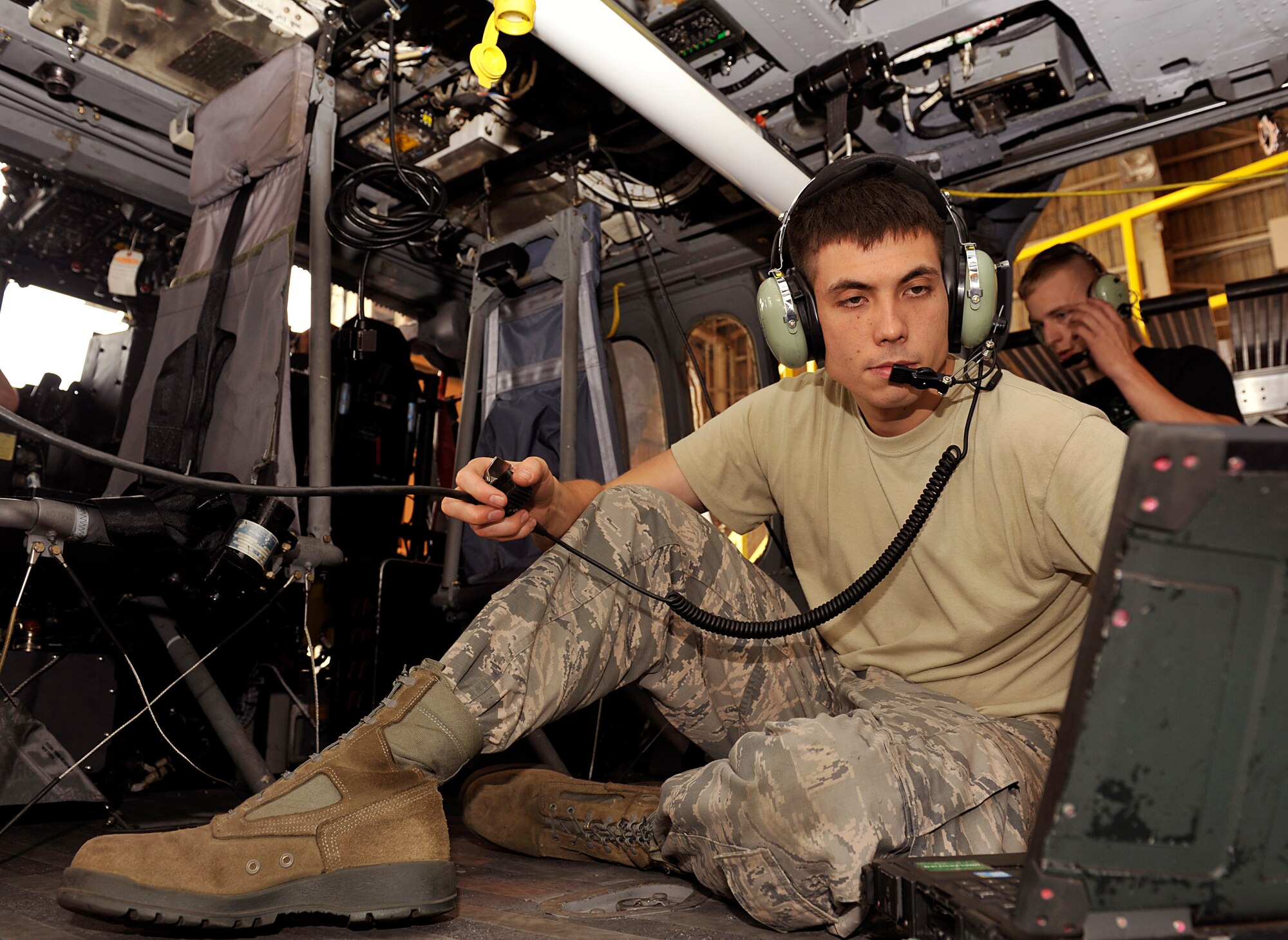 U. S. Air Force Senior Airman Eric Sperry, 33rd Helicopter Maintenance Unit guidance and control system journeyman, troubleshoots the automatic flight control system during a quality assurance inspection on Kadena Air Base, Japan, May 9, 2014. The quality assurance inspection helps ensure quality of work and safety instructions are followed. (U.S. Air Force photo by Naoto Anazawa)