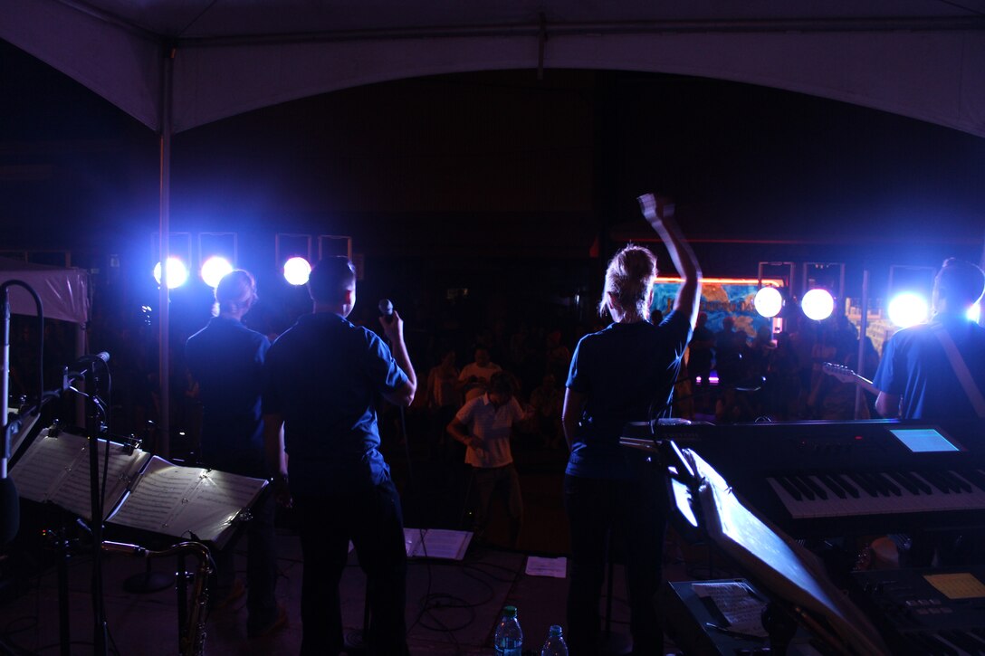 WAILUKU, Maui, Hawaii - Hana Hou, the pop/rock horn group performs for an enthusiastic crowd for the Wailuku First Friday street celebration.  Pictured left to right are vocalists Staff Sergeant Courtney Clifford, Senior Airman Devin Rivas-Martin, Master Sergeant Lara Murdzia, and guitarist Staff Sergeant Aaron Kusterer.
(US Air Force Photo/TSgt Michael Smith/Released)