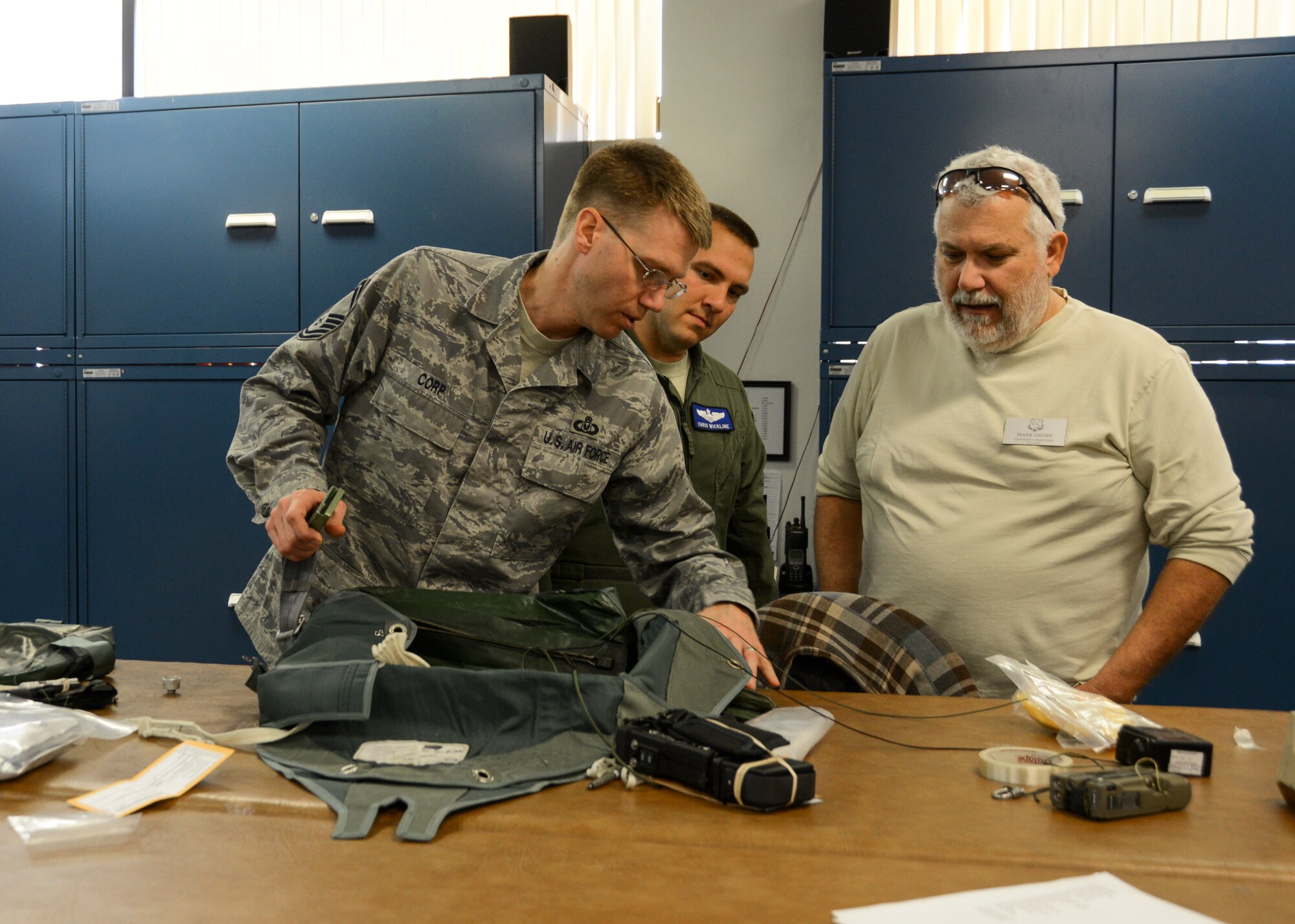 Senior Master Sgt. Jonathan Corp, 412th Operations Support Squadron (left) shows life support equipment to honorary commander Mark Grubb (right). Grubb is the local honorary commander for the 411th Flight Test Squadron. (U.S. Air Force photo by Rebecca Amber)