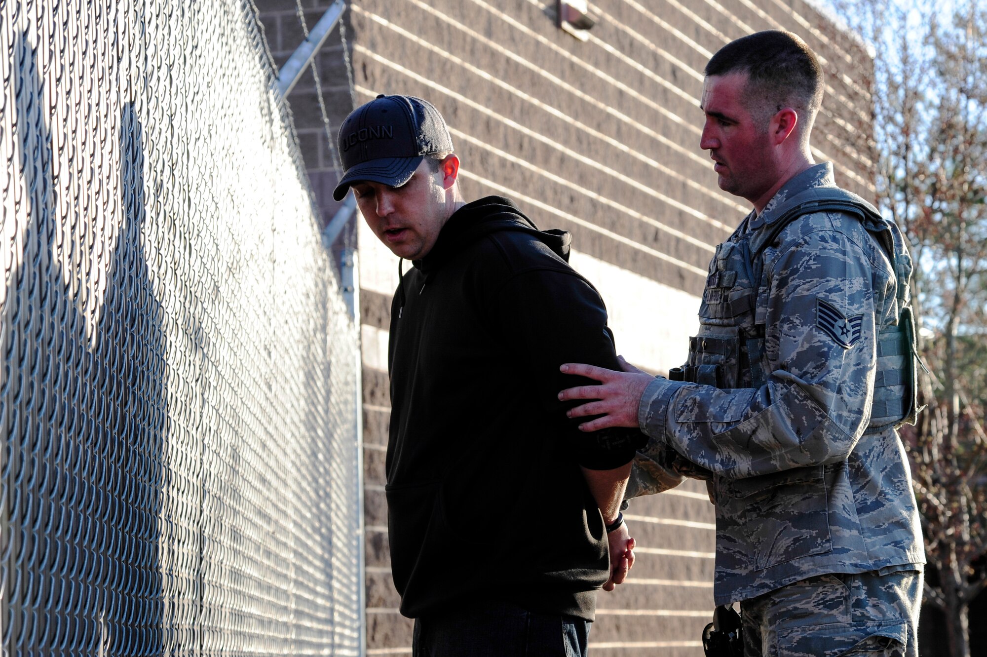 Staff Sgt. Stephen Bratcher, 354th Security Forces Squadron flight sergeant, apprehends a simulated suspect during high-risk response training May 8, 2014, Eielson Air Force Base, Alaska. SFS squadrons from around Pacific Air Forces participated in the training to help prepare to meet potentially dangerous situations on military installations. (U.S. Air Force photo by Senior Airman Zachary Perras/Released)