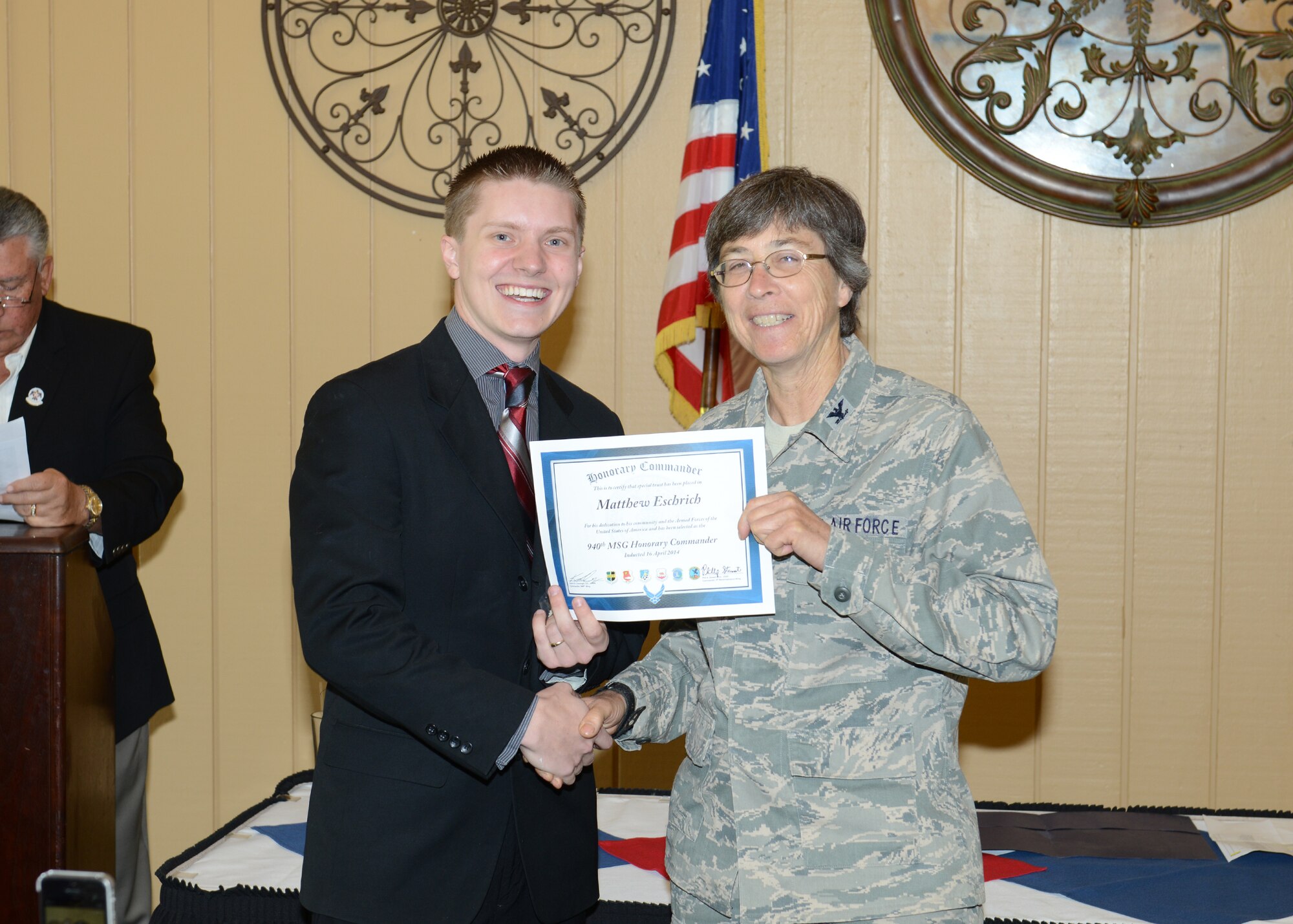 Matthew Eschrich, sales director for the Rocklin Area Chamber of Commerce, is inducted for his second year as 940th Mission Support Group's honorary commander by the reserve unit's commander, Col. Patricia Brewer, at a ceremony hosted by the Beale Military Liaison Committee, April 16, at the Peach Tree Golf Club in Marysville, Calif. The honorary commander program is a unique opportunity to foster an understanding of the Air Force and its missions among a cross-section of local community leaders. (U.S. Air Force photo by John Schwab) 