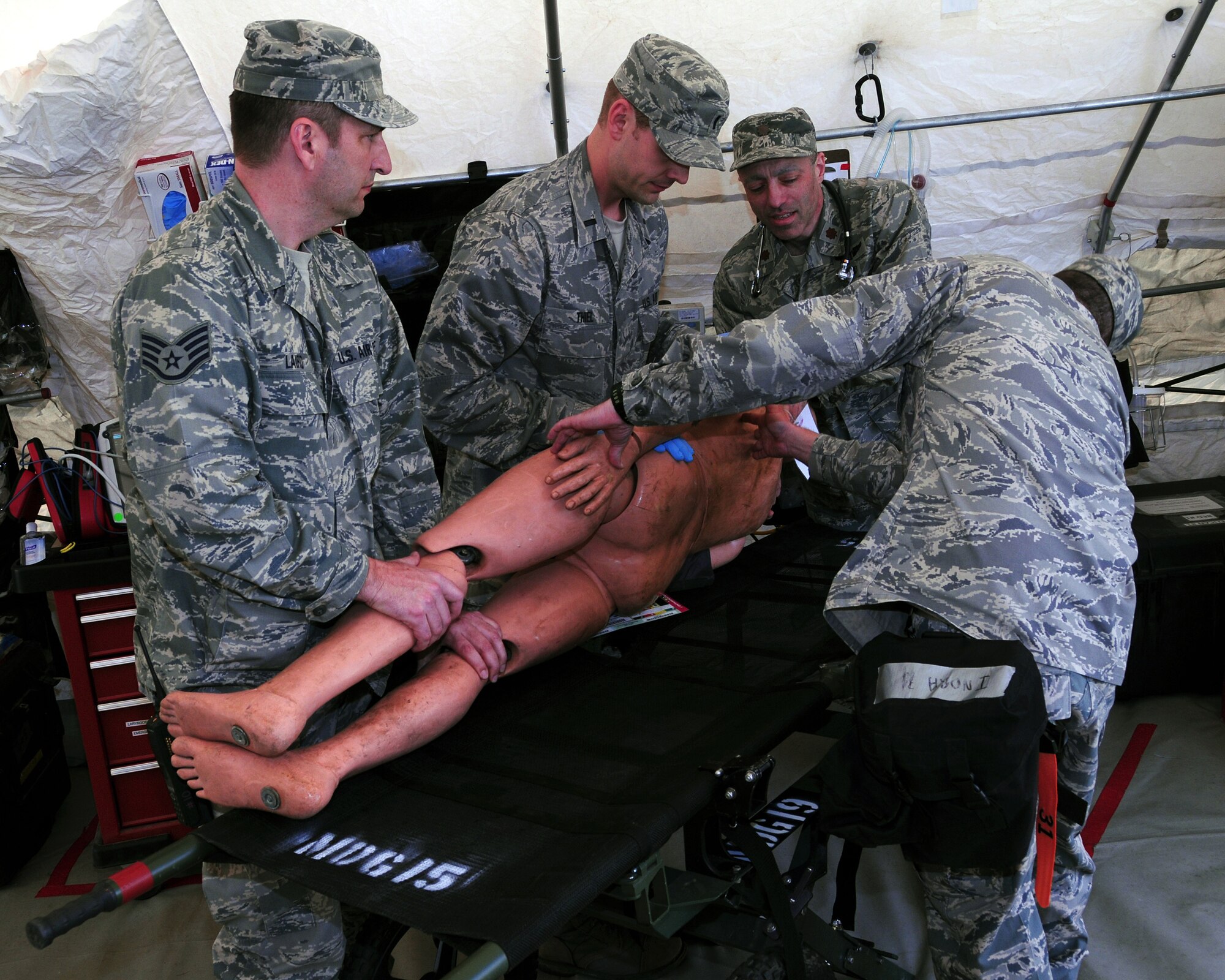 Wisconsin Air National Guard specialists provide mass medical care during an emergency preparedness exercise in Portage, Wisconsin, May 3, 2014. Columbia County Emergency Management, Divine Savior Hospital and the Wisconsin National Guard teamed up to practice the coordination and implementation of  their disaster response capabilities. (Air National Guard photo by Staff Sgt. Ryan Roth)