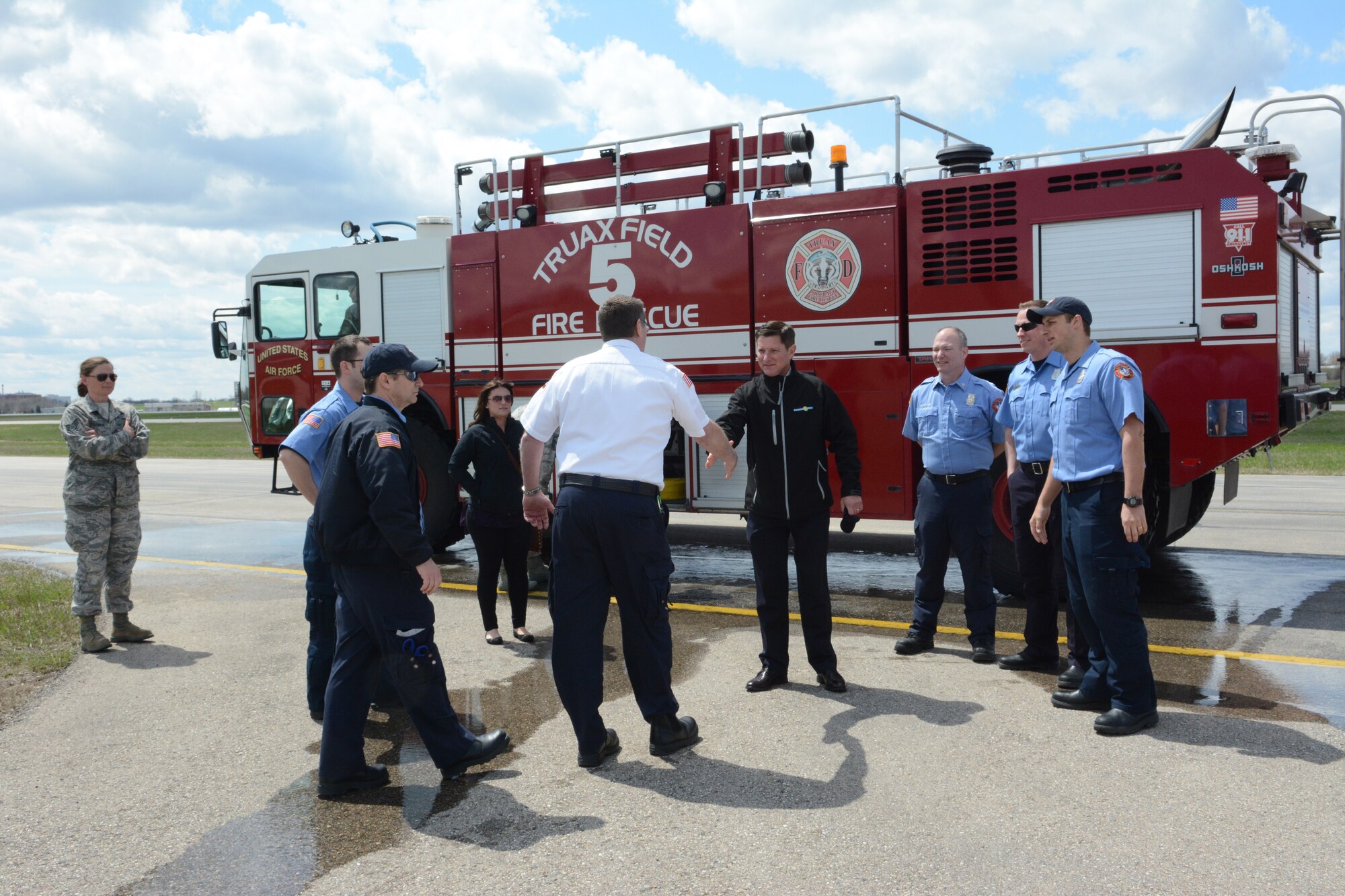 Dick Leinenkugel, Leinenkugel’s business development manager, greets Fire/Crash Rescue personnel during a base visit to the 115 FW, Madison, Wis., May 3, 2014. The Leinenkugel family visited the base to share insight on how their military background helped them become a successful Wisconsin-based company. (Air National Guard photo by Senior Airman Andrea F. Liechti)
