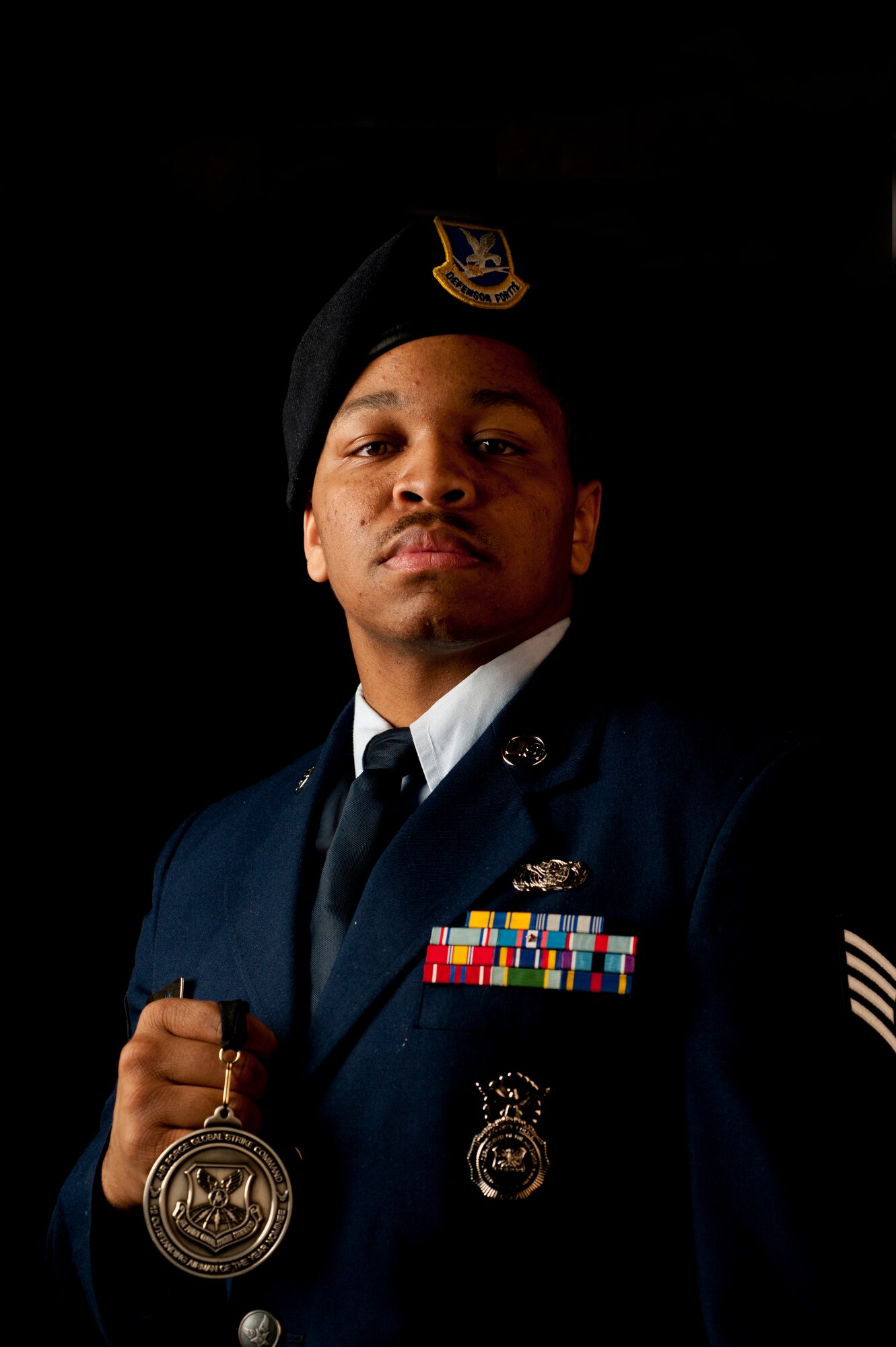 Staff Sgt. David Wallace III, 91st Security Forces Group plans and programs section, poses for a photo at Minot Air Force Base, N.D., May 9, 2014. Wallace was named one of 12 Outstanding Airmen of the Year for 2014. (U.S. Air Force photo/Senior Airman Brittany Y. Auld)