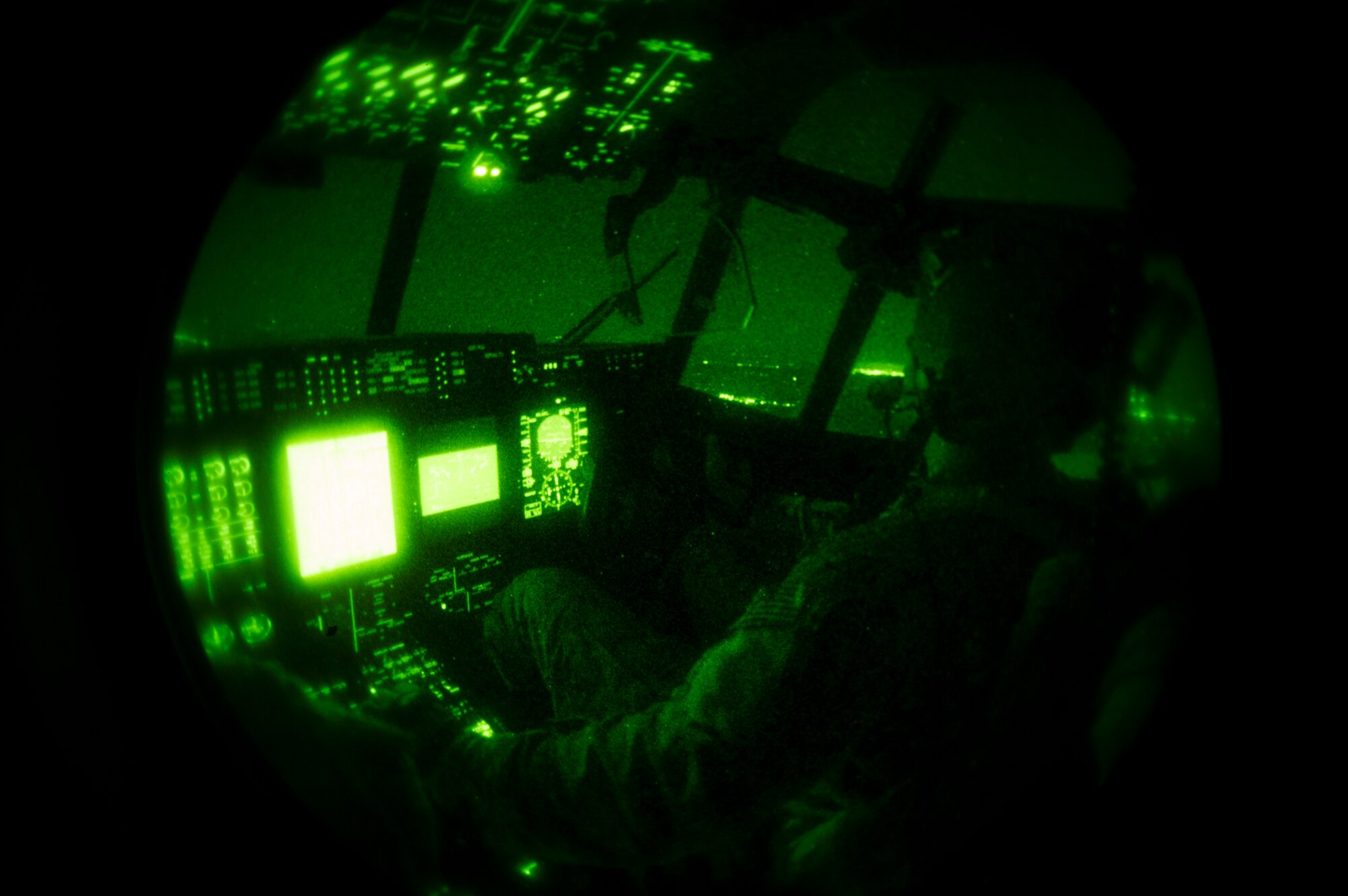U.S. Air Force Capt. Alexander Burgess, a pilot with the 522nd Special Operations Squadron, performs an in-air refueling in an MC-130J Commando II aircraft over Florida May 6, 2014, during Emerald Warrior 14. Emerald Warrior is a U.S. Special Operations Command-sponsored two-week joint/combined tactical exercise designed to provide realistic military training in an urban setting. (U.S. Air Force photo by Staff Sgt. Marleah Miller)