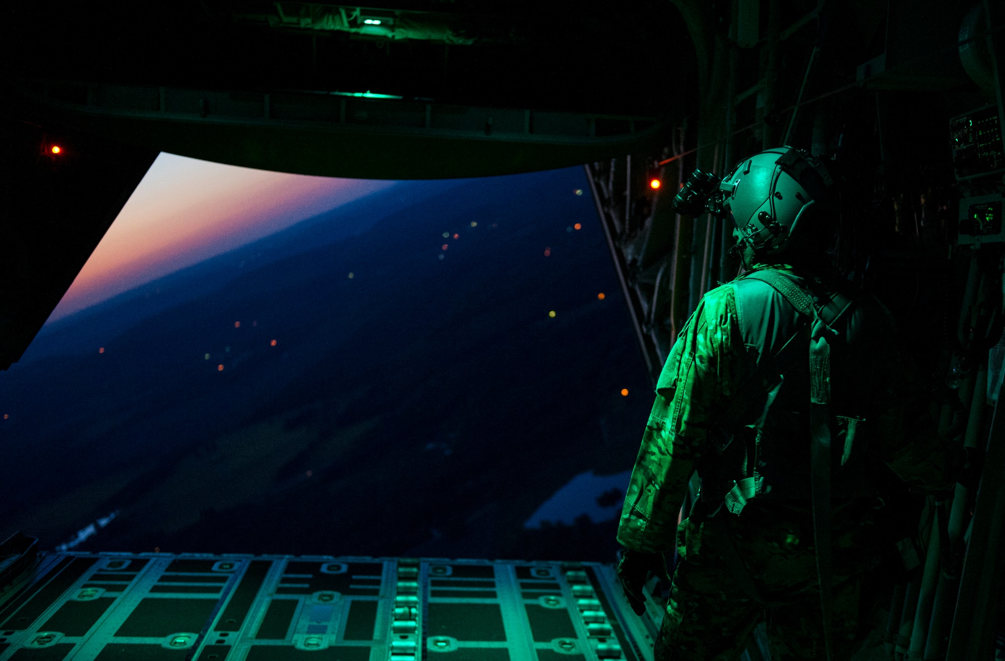 U.S. Air Force Staff Sgt. Bronc Berry, a loadmaster with the 522nd Special Operations Squadron, closes the ramp of an MC-130J Commando II aircraft after an airdrop and static line jump May 6, 2014, during Emerald Warrior 14 at Hurlburt Field, Fla. Emerald Warrior is a U.S. Special Operations Command-sponsored two-week joint/combined tactical exercise designed to provide realistic military training in an urban setting. (DoD photo by Staff Sgt. Marleah Miller, U.S. Air Force)
