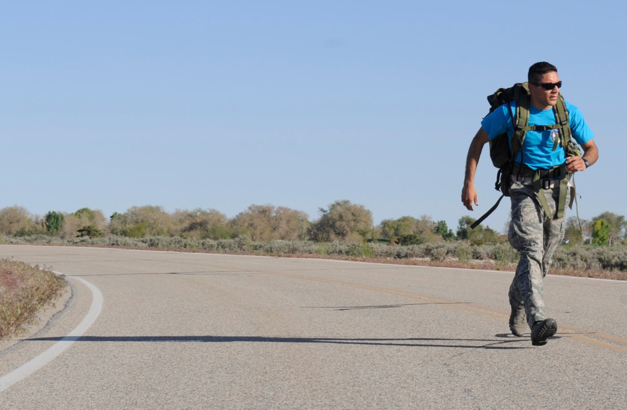 Airman 1st Class Bernardo Gonzalez, 366th Aerospace Medicine Squadron bioenvironmental engineer, participates in the Ruck March to Remember 10K during the 2014 National Police Week, May 12, 2014, at Mountain Home Air Force Base, Idaho. The week-long commemoration will include various events to include an open house and a golf tournament. (U.S. Air Force photo by Senior Airman Caitlin Guinazu/Released)