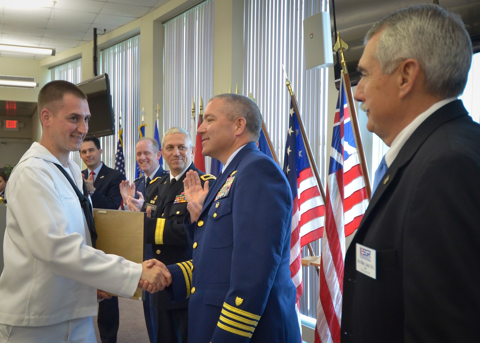 Nave Petty Officer 2nd Class Phillip Balestrieri receives the Richard I. Bong Award for his outstanding skill, dedication, and professionalism on and off duty.  The Employer Support of the Guard and Reserve sponsored the annual Breakfast with the Boss event here at the 128th Air Refueling Wing on May 12, 2014.  (U.S. Air National Guard photo by Staff Sgt. Jenna Lenski/Released).