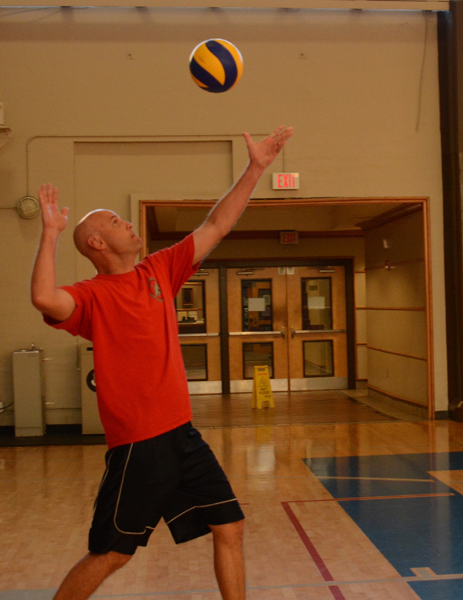 Col. Wayne Straw, Squadron Officer College, serves the ball during the 2014 Maxwell-Gunter Air Force Base intramural volleyball championship, May 6, 2014. The SOC team was defeated in two rounds of play by a team of students from the Air Command and Staff College. (U.S. Air Force Photo by Staff Sgt. Gregory Brook