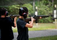 Two “soldiers in training” fire their rifles downrange during the 6th Ranger Training Battalion’s Open House event May 10 at Eglin Air Force Base, Fla.  The event was a chance for the public to learn how Rangers train and operate. The event displays showed equipment, weapons, a reptile zoo, face painting and weapon firing among others. The demonstrations showed off hand-to-hand combat, a parachute jump, snake show, and Rangers in action.  (U.S. Air Force photo/Tech. Sgt. Sam King)