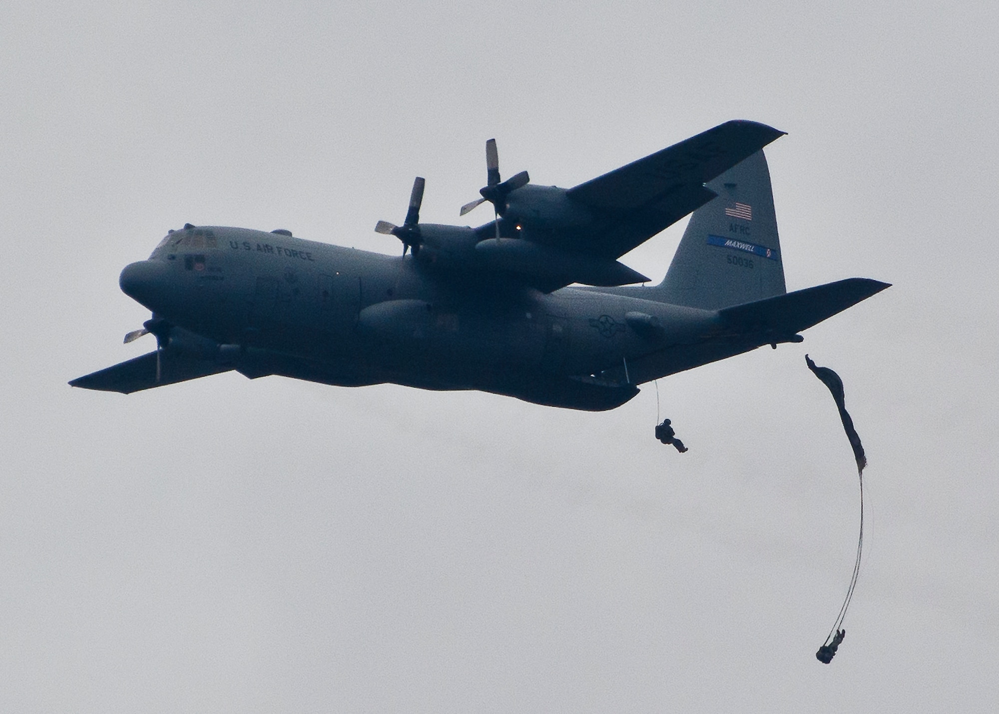 Soldiers from the 6th Ranger Training Battalion jump from a 908th Airlift Wing C-130 Hercules May 10 at Eglin Air Force Base, Fla.  The Rangers hitched a ride with the reserve aircrew only to jump out of the back of the aircraft as part of the 6th RTB’s Open House activities.  (U.S. Air Force photo/Tech. Sgt. Sam King)