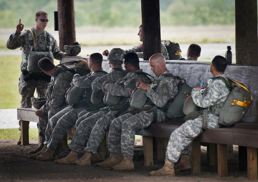 An Army captain briefs his Soldiers about an upcoming parachute jump at the 6th Ranger Training Battalion’s Open House event May 10 at Eglin Air Force Base, Fla.  The event was a chance for the public to learn how Rangers train and operate. The event displays showed equipment, weapons, a reptile zoo, face painting and weapon firing among others. The demonstrations showed off hand-to-hand combat, a parachute jump, snake show, and Rangers in action.  (U.S. Air Force photo/Tech. Sgt. Sam King)