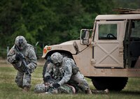 Rangers check enemies for intelligence during a demonstration at the 6th Ranger Training Battalion’s Open House event May 10 at Eglin Air Force Base, Fla.  The event was a chance for the public to learn how Rangers train and operate. The event displays showed equipment, weapons, a reptile zoo, face painting and weapon firing among others. The demonstrations showed off hand-to-hand combat, a parachute jump, snake show, and Rangers in action.  (U.S. Air Force photo/Tech. Sgt. Sam King)