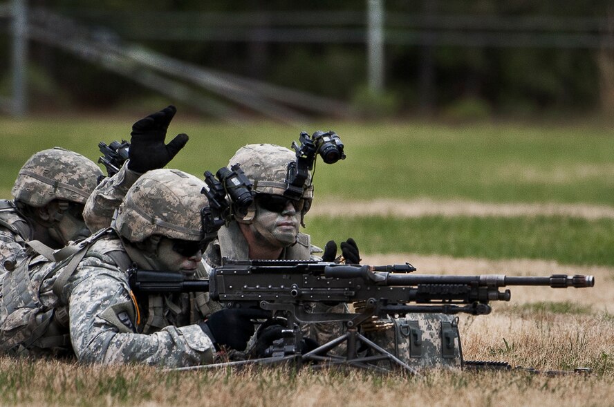 The heavy gunner and his partner prepare to engage a target during a demonstration at the 6th Ranger Training Battalion’s Open House event May 10 at Eglin Air Force Base, Fla.  The event was a chance for the public to learn how Rangers train and operate. The event displays showed equipment, weapons, a reptile zoo, face painting and weapon firing among others. The demonstrations showed off hand-to-hand combat, a parachute jump, snake show, and Rangers in action.  (U.S. Air Force photo/Tech. Sgt. Sam King)