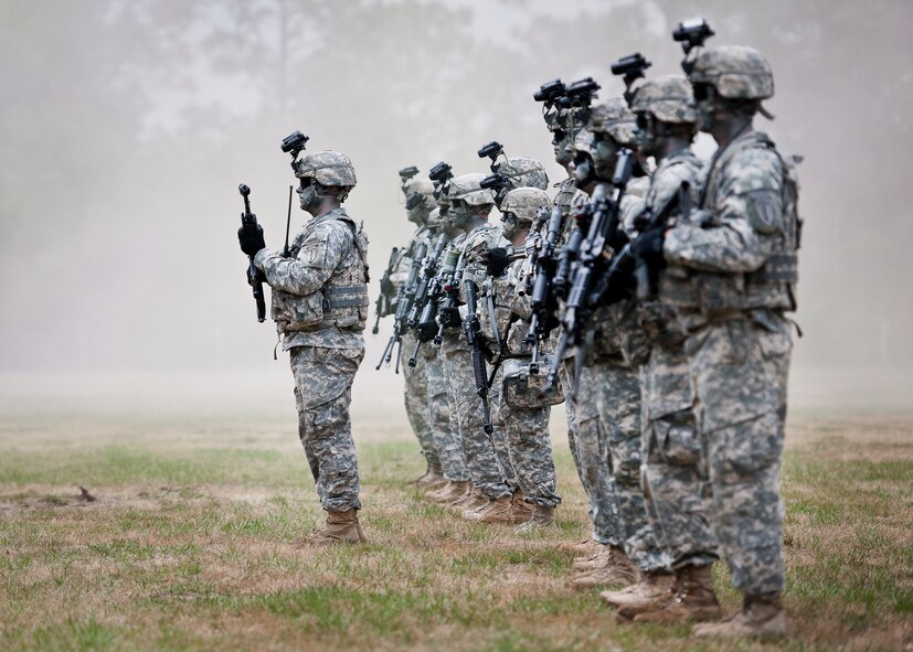 The Ranger team leader steps forward during a demonstration at the 6th Ranger Training Battalion’s Open House event May 10 at Eglin Air Force Base, Fla.  The event was a chance for the public to learn how Rangers train and operate. The event displays showed equipment, weapons, a reptile zoo, face painting and weapon firing among others. The demonstrations showed off hand-to-hand combat, a parachute jump, snake show, and Rangers in action.  (U.S. Air Force photo/Tech. Sgt. Sam King)