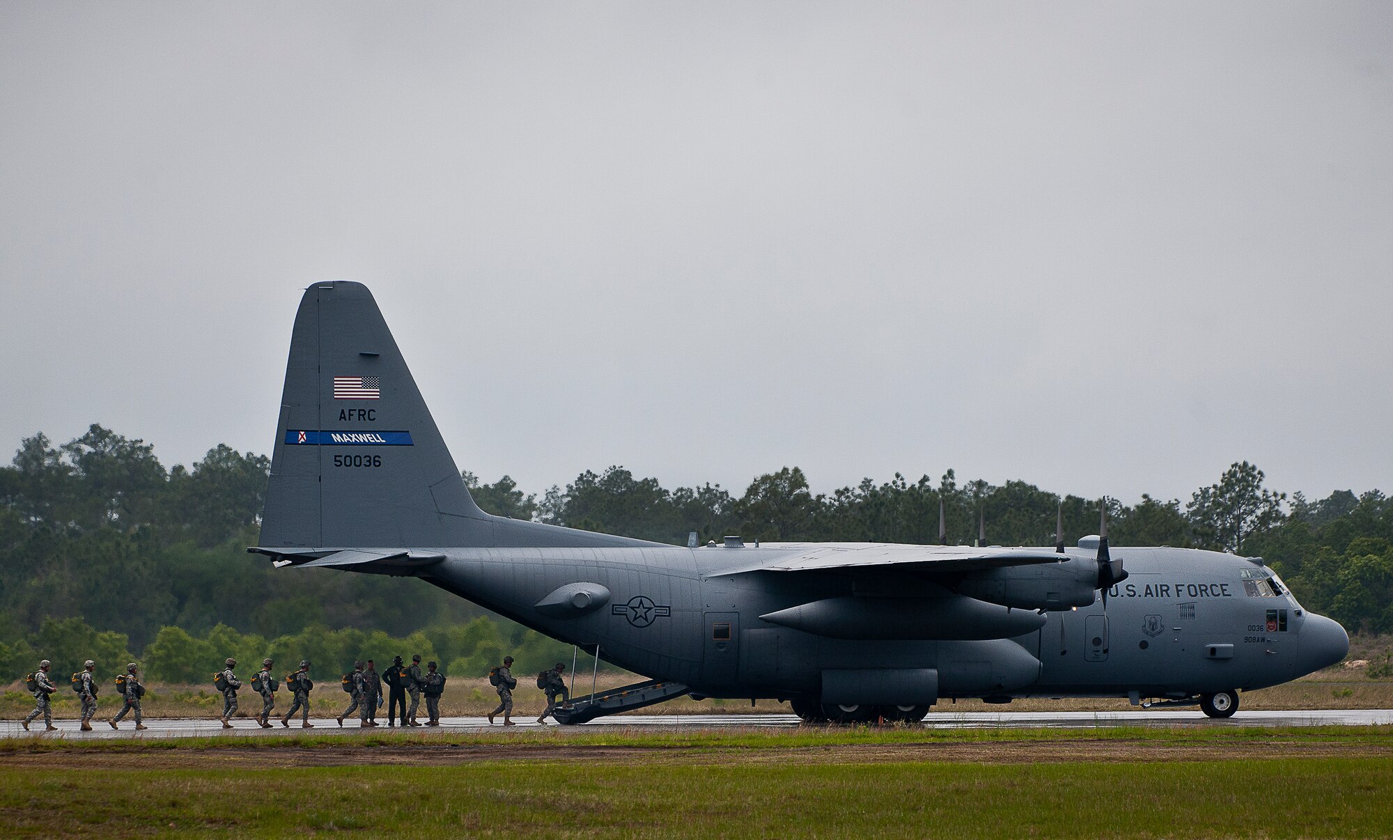 Soldiers from the 6th Ranger Training Battalion board a 908th Airlift Wing C-130 Hercules prior to takeoff May 10 at Eglin Air Force Base, Fla.  The Rangers hitched a ride with the reserve aircrew only to jump out of the back of the aircraft as part of the 6th RTB’s Open House activities.  (U.S. Air Force photo/Tech. Sgt. Sam King)