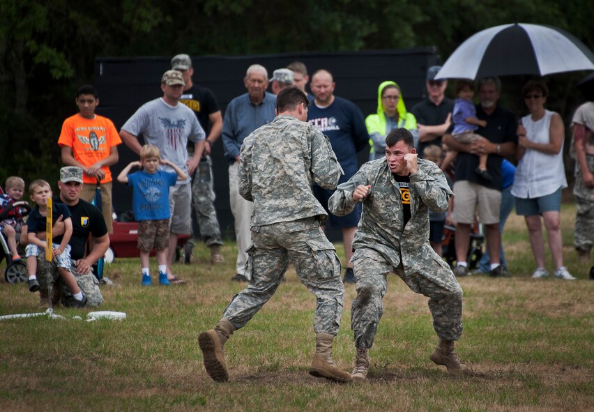 Soldiers from the 6th Ranger Training Battalion perform hand-to-hand combat maneuvers during a demonstration at the Rangers’ Open House event May 10 at Eglin Air Force Base, Fla.  The event was a chance for the public to learn how Rangers train and operate. The event displays showed equipment, weapons, a reptile zoo, face painting and weapon firing among others. The demonstrations showed off hand-to-hand combat, a parachute jump, snake show, and Rangers in action.  (U.S. Air Force photo/Tech. Sgt. Sam King)