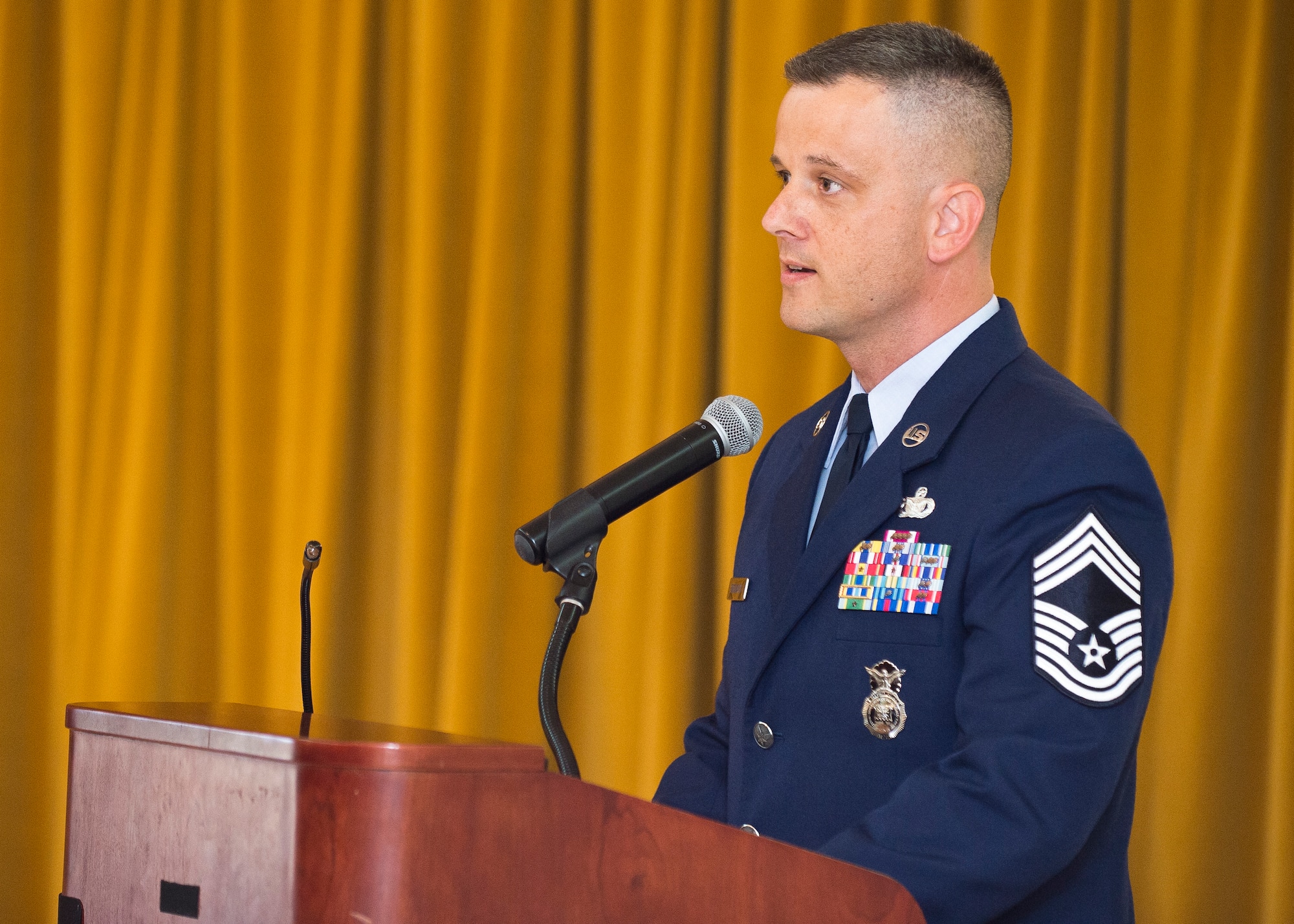 Chief Master Sgt. James Segebarth, 412th Security Force Squadron, Security Forces manager, served as guest speaker at Edwards AFB's 2014 Community College of the Air Force graduation ceremony May 7. (U.S. Air Force photo by Ethan Wagner)