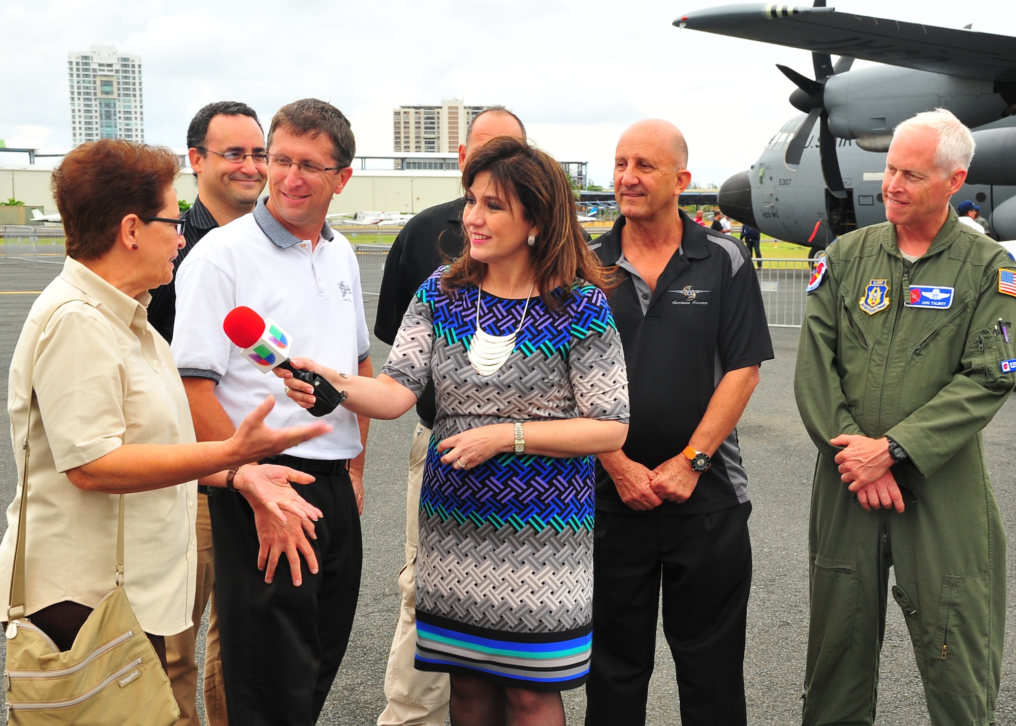 A Univision Reporter interviews Gladys Rubio, meteorologist with the National Hurricane Center Tropical Analysis and forecast branch, Dr. Richard Knabb, NHC director, Dr. Lixion Avila, NHC senior hurricane specialist, and Lt. Col. Jon Talbot, 53rd Weather Reconnaissance Squadron chief meteorologist, May 9, in Puerto Rico during the Caribbean Hurricane Awareness Tour. More than 4,000 people attended the tour May 4-11, 2014, at Manzanillo, Zihuatanejo and Huatulco, Mexico, St. Vincent, and San Juan, Puerto Rico. (U.S. Air Force photo/Maj. Marnee A.C. Losurdo)