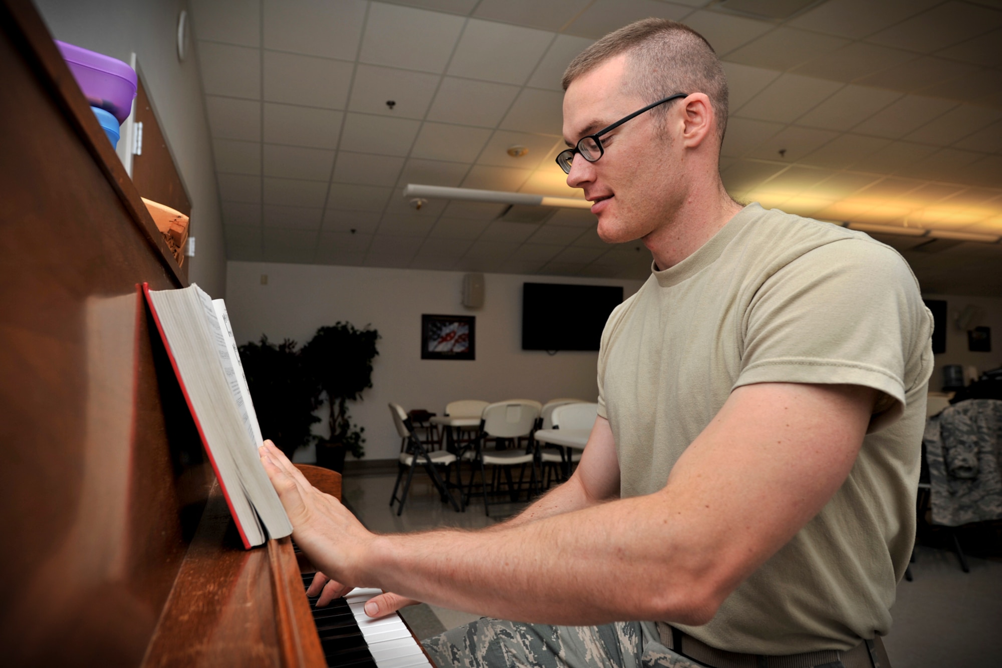 GOODFELLOW AIR FORCE BASE, Texas – 2nd Lt. Chad T. Slayton, 17th Training Wing Assistant Air Reserve Component liaison, plays the notes for America the Beautiful on a piano at the Taylor Chapel here May 6. Slayton is a member of the base singing group Patriotic Blue. (U.S. Air Force photo/ Airman 1st Class Devin Boyer)
